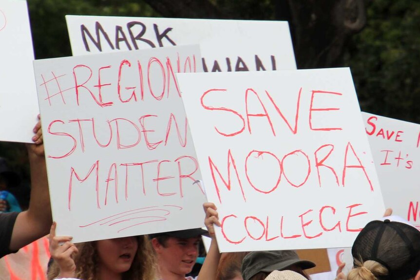 Protestors holding placards calling for Moora Residential College to remain open.