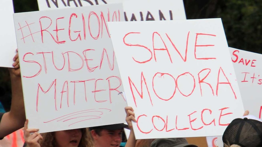 Protestors holding placards calling for Moora Residential College to remain open.