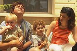 Edwin Casey Dobinson, Dale Freestone and their two children outside their weatherboard cottage in the NSW village of Bungendore.