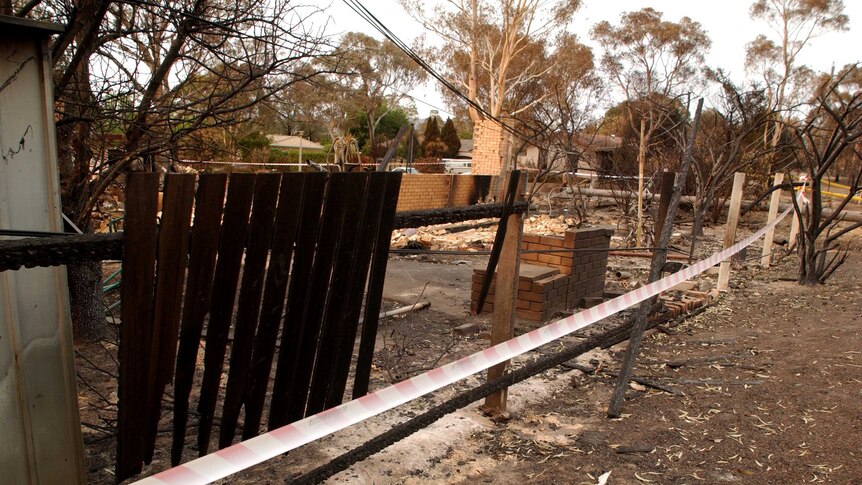 Fire damaged houses and boundary fencing at Kambah.