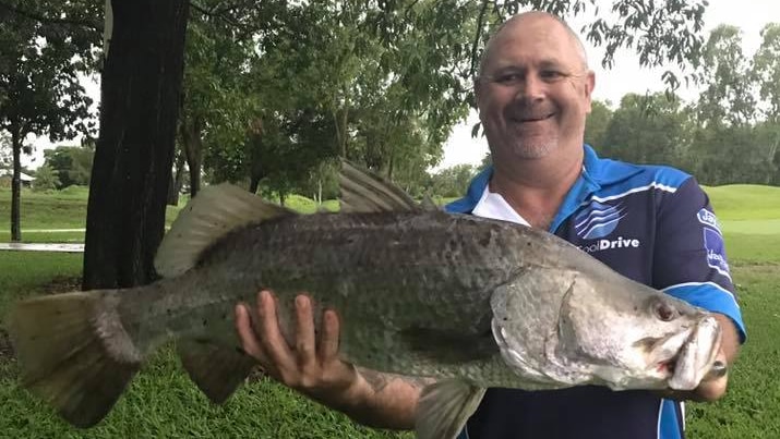 A barra kept alive in a golf course bunker