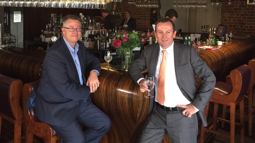 Evan Hall with Opposition Leader Mark MacGowan at a Perth bar with glasses of water.