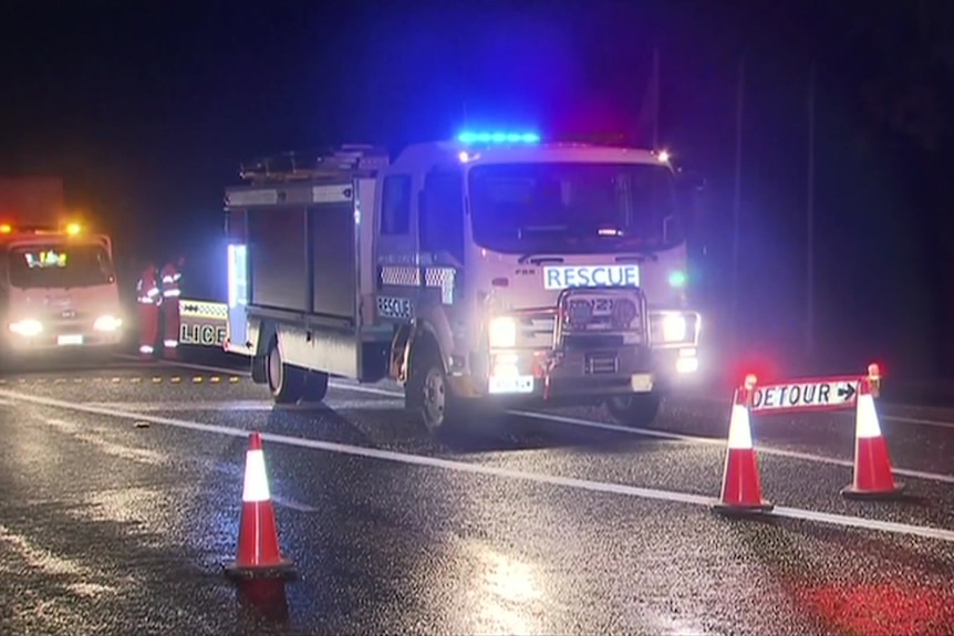 A CFS truck with its lights on and a detour sign on the road