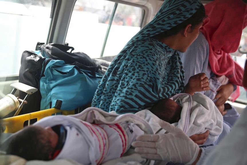 Babies are taken away by ambulance after gunmen attacked a maternity hospital, in Kabul, Afghanistan.