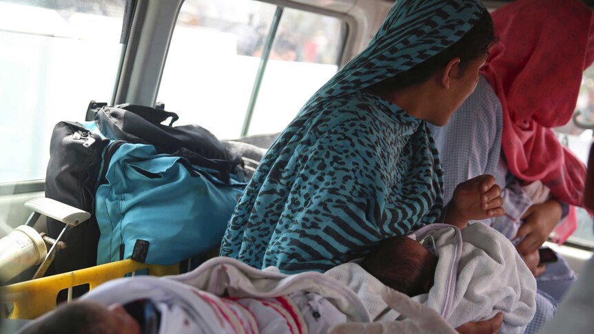 Babies are taken away by ambulance after gunmen attacked a maternity hospital, in Kabul, Afghanistan.