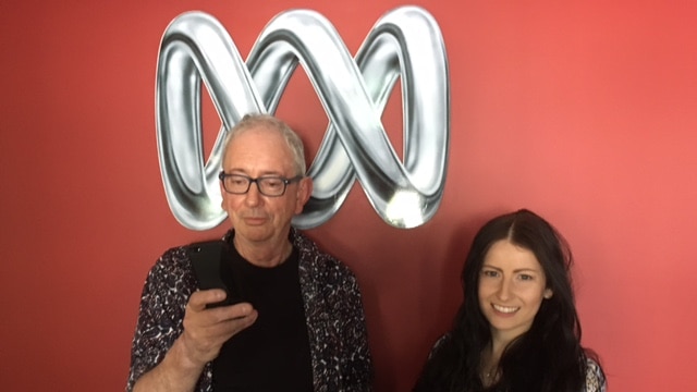 David Broker and Lee Usher-Clarke with their smartphones in the 666 ABC Canberra studios.