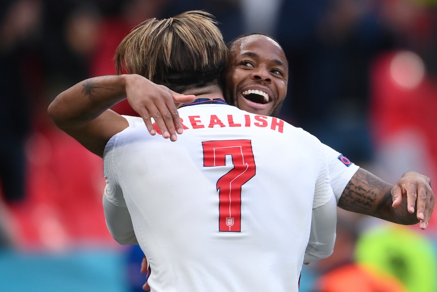 Raheem Sterling and Jack Grealish hug