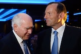 John Howard and Tony Abbott speak at a Liberal Party fundraising dinner in Sydney.