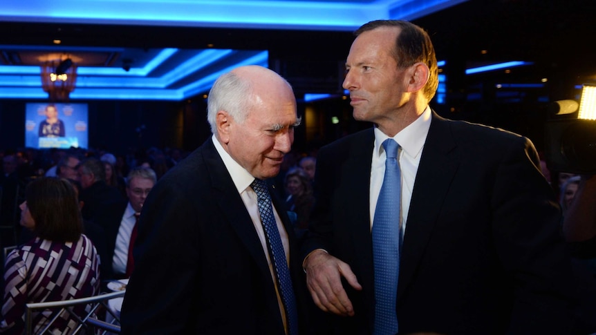 John Howard and Tony Abbott speak at a Liberal Party fundraising dinner in Sydney.