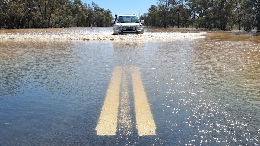 Car in floodwaters.