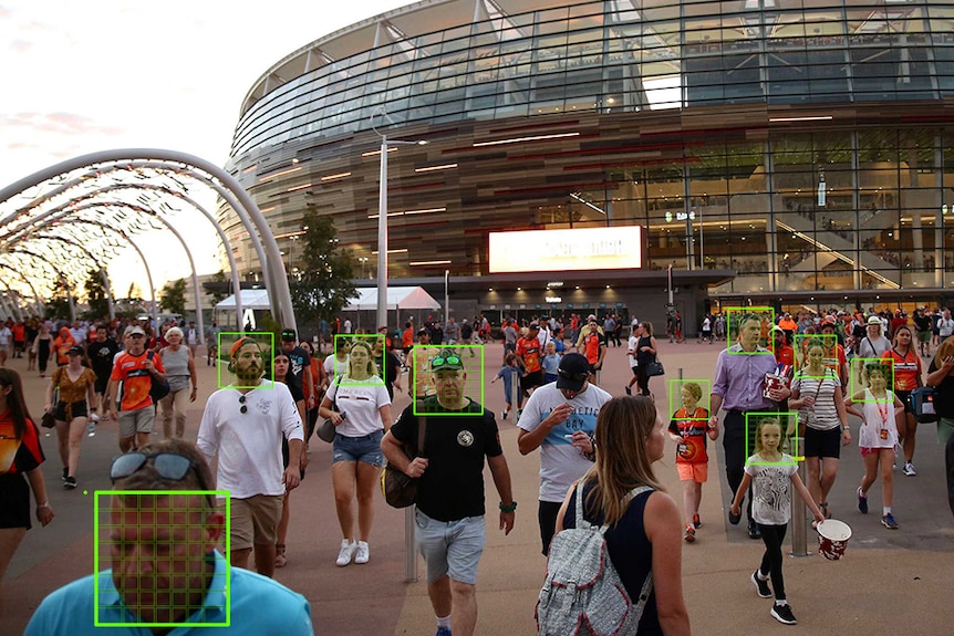 A crowd outside Perth Stadium with green scanning graphics over some people's faces.