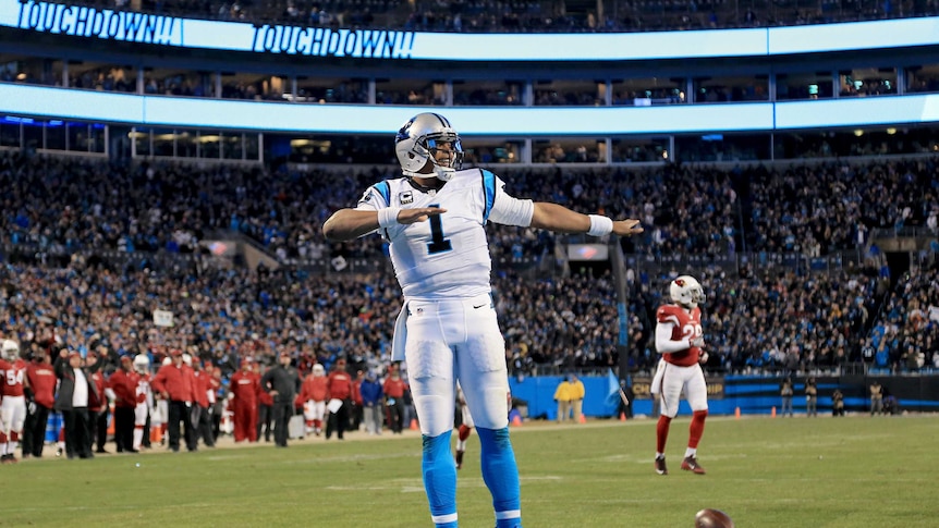 Carolina Panthers quarterback Cam Newton celebrates a touchdown against Arizona in NFC title game.