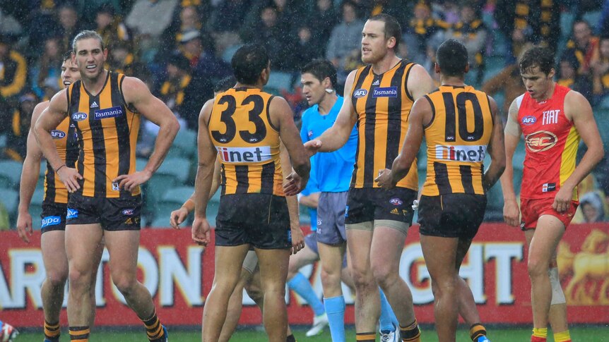 Jarryd Roughead enjoying soggy conditions against the Suns