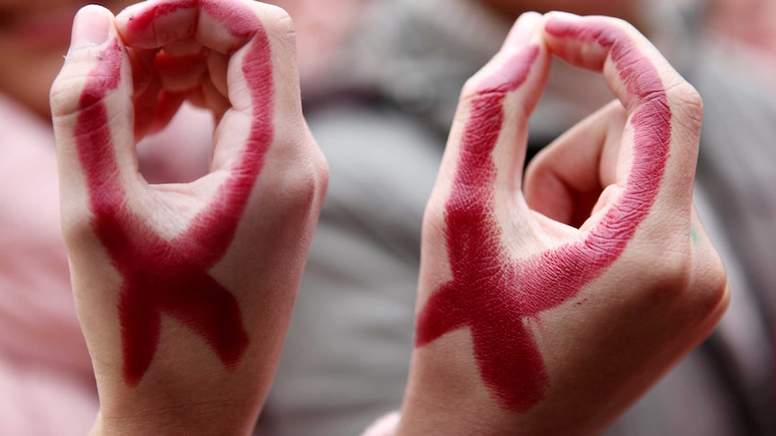 There seem to be so few of them wearing a Red Ribbon for World AIDS Day (AFP)