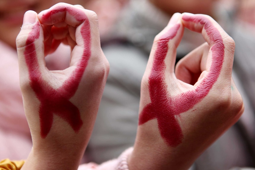 There seem to be so few of them wearing a Red Ribbon for World AIDS Day (AFP)