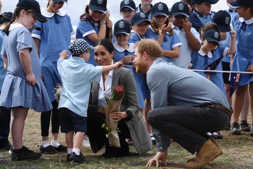 Royal couple greeted by school children