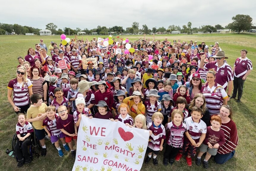 Community group photo supporting outback rugby league team
