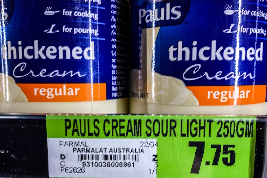 Labels in a shop mark the price of cream at $7.75