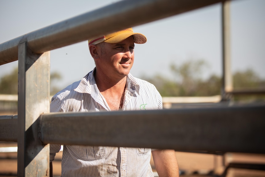 Photo of a middle aged man at a cattle yard.