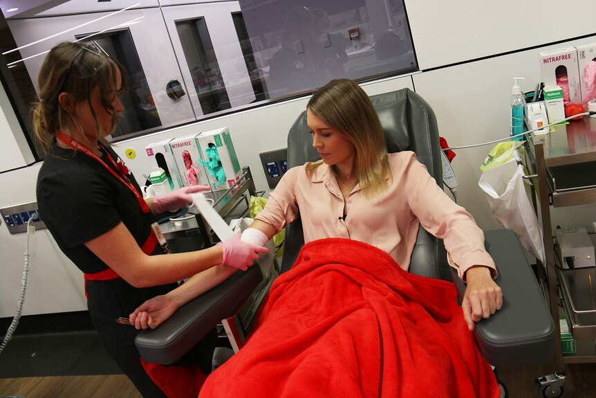 ABC reporter Ellie Sibson gives blood at Ipswich donor centre of Australian Red Cross Blood Service in April 2017