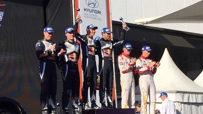 Sebastian Ogier receiving the trophy after winning Rally Australia 2015.