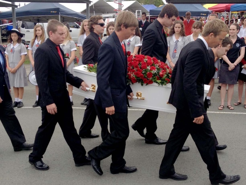 Pallbearers carry the coffin of Daniel Morcombe