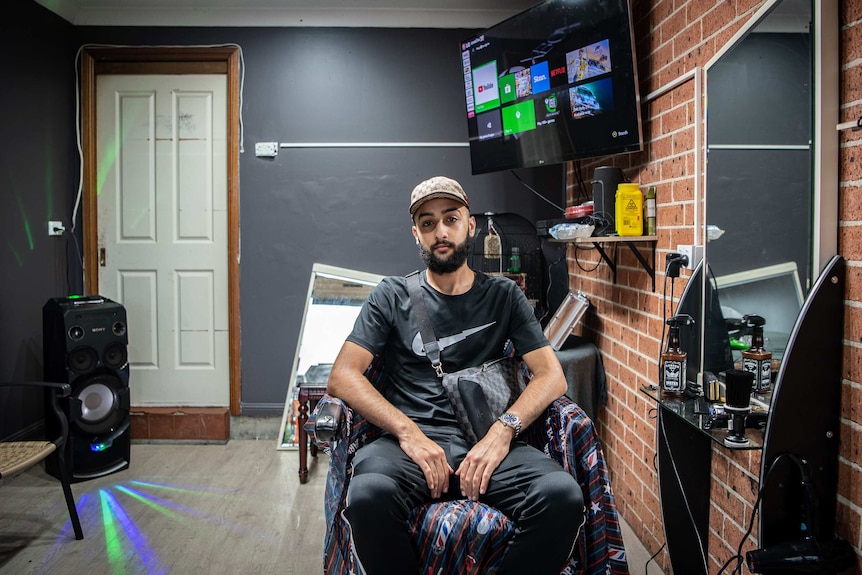 A man in a home barbershop