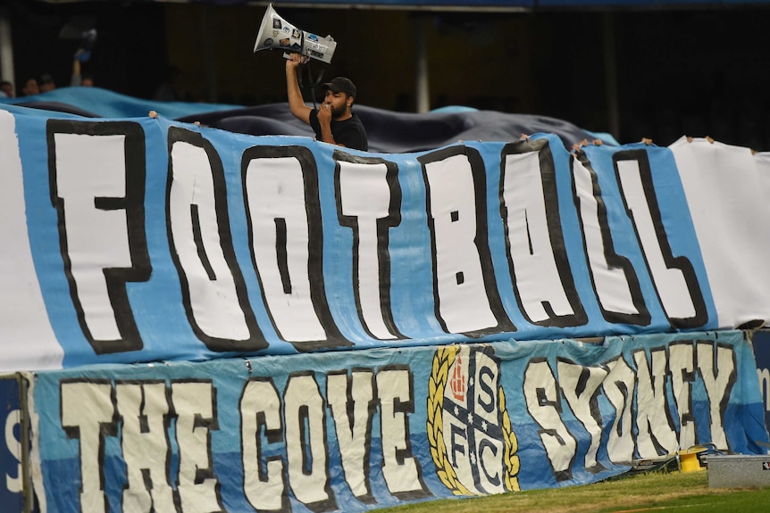 A banner identifying The Cove at a Sydney FC A-League match.