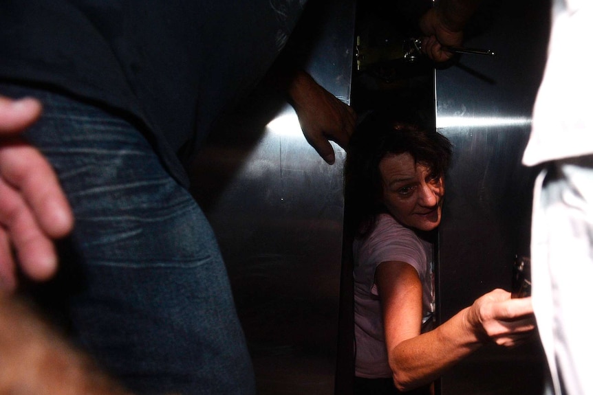 Yeppoon hotel staff member scrambles out of stuck lift