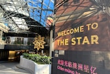 A display screen that says 'Welcome to The Star' outside a building.