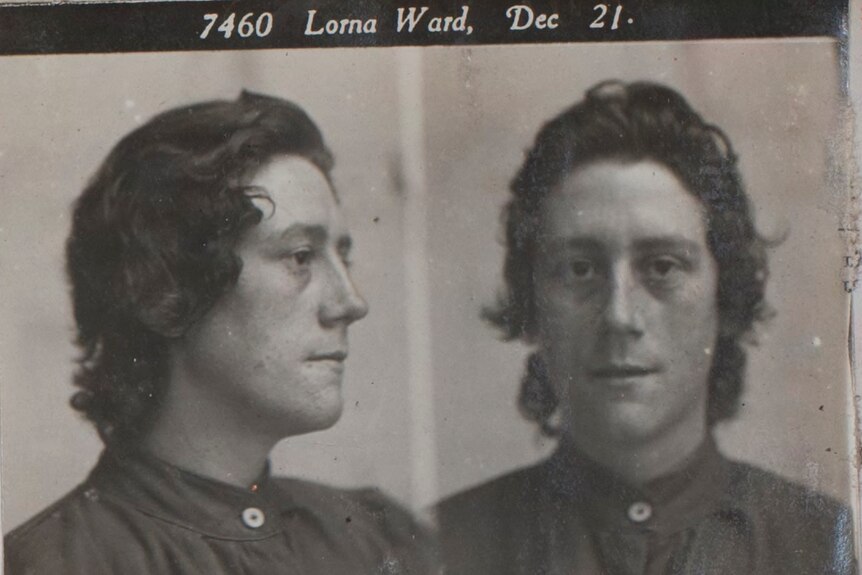 Black and white prison photo of young woman.