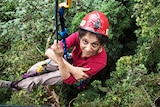 Nalini Nadkarni ascends a fig tree close up