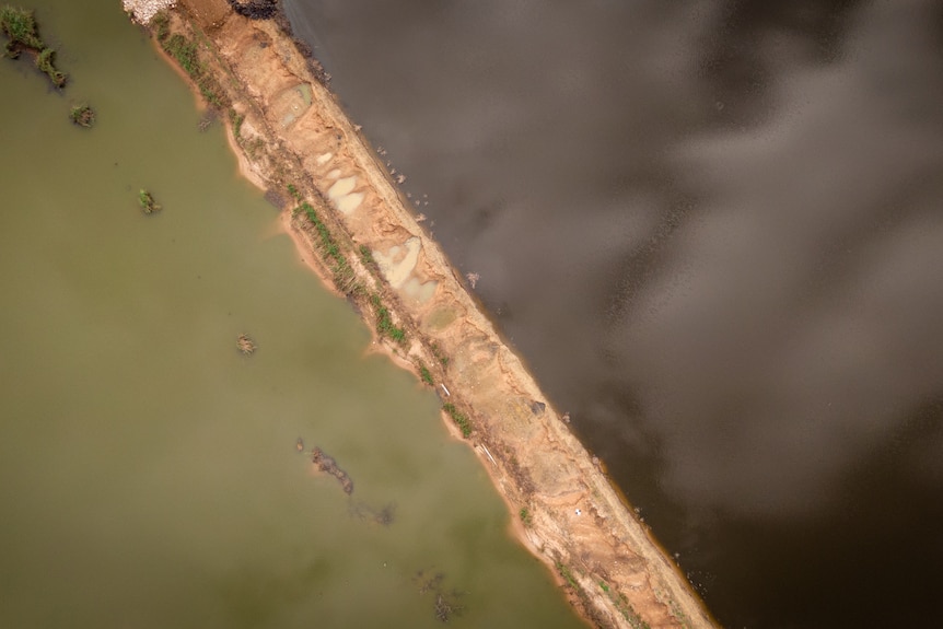 A drone shot of a water below.