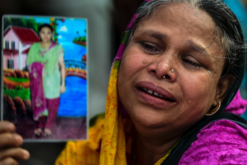 Woman holds a picture