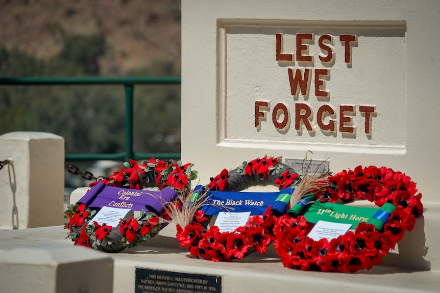 Three wreath laid at a memorial