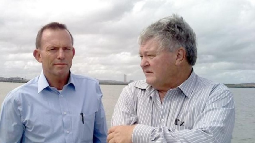 (LtoR) Opposition Leader Tony Abbott talks to Member for Flynn Ken O'Dowd in Gladstone.
