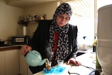 Ghed Al Sabti prepares traditional Iraqi tea at her Perth home.