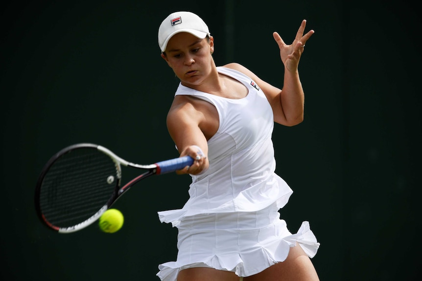 Ashleigh Barty plays a forehand at Wimbledon