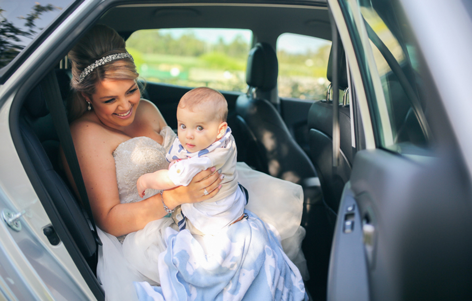 Amanda with their six-month-old son, Bentley, before walking down the aisle.