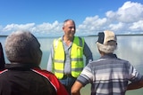 NT Chief Minister Adam Giles at Port Melville speaking to Tiwi Traditional Owners Gibson Illortaminni and Cyril Kalippa