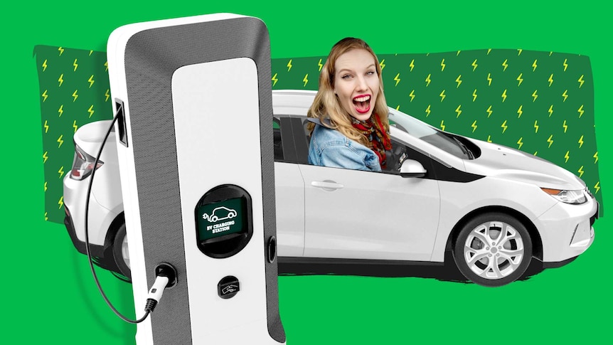 An electric car with Liv looking excited in the drivers seat. A charging station next to it.