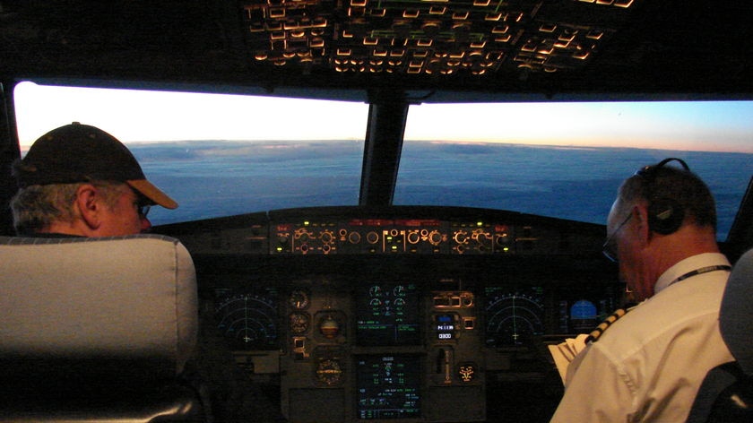 The pilot and co-pilot in the cockpit of an Airbus 315 on its way to Antarctica