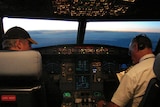 The pilot and co-pilot in the cockpit of an Airbus 315