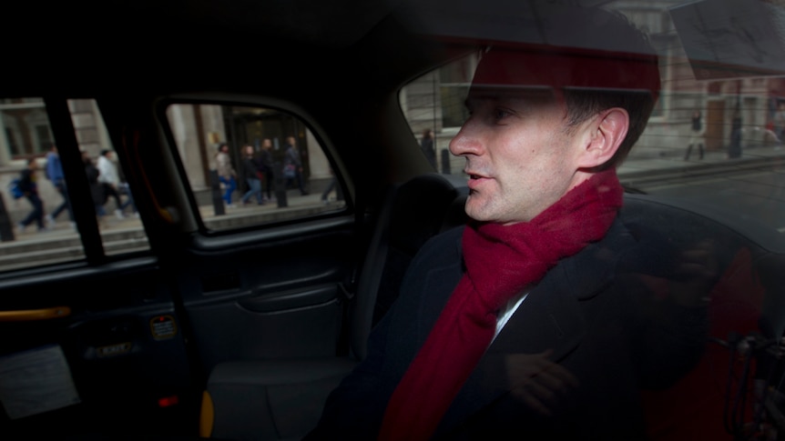British culture secretary Jeremy Hunt leaves his office in a taxi