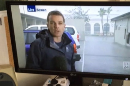 Reporter Josh Bavas doing a cross from the Bowen motel room.