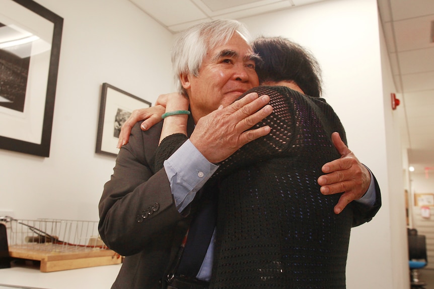 Photographer Nick Ut hugs Kim Phuc who at 9 years old was the subject of the "napalm girl" photo