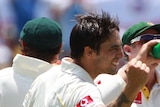 Six and out: Mitchell Johnson roared back to form with 6 for 38 to skittle England for 187 on day two.
