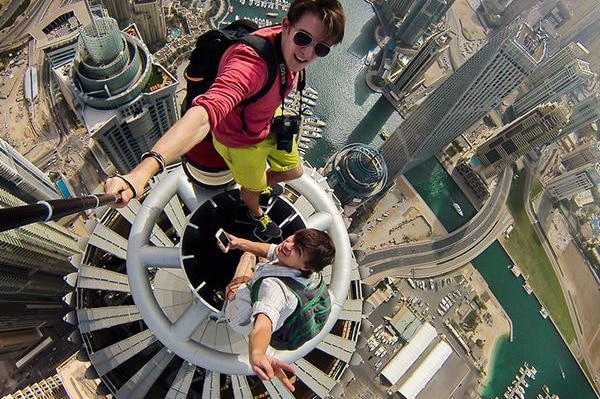 Russian Alexander Remnev and a friend scaled the Princess Tower in Dubai, the world's tallest residential building at 414m.