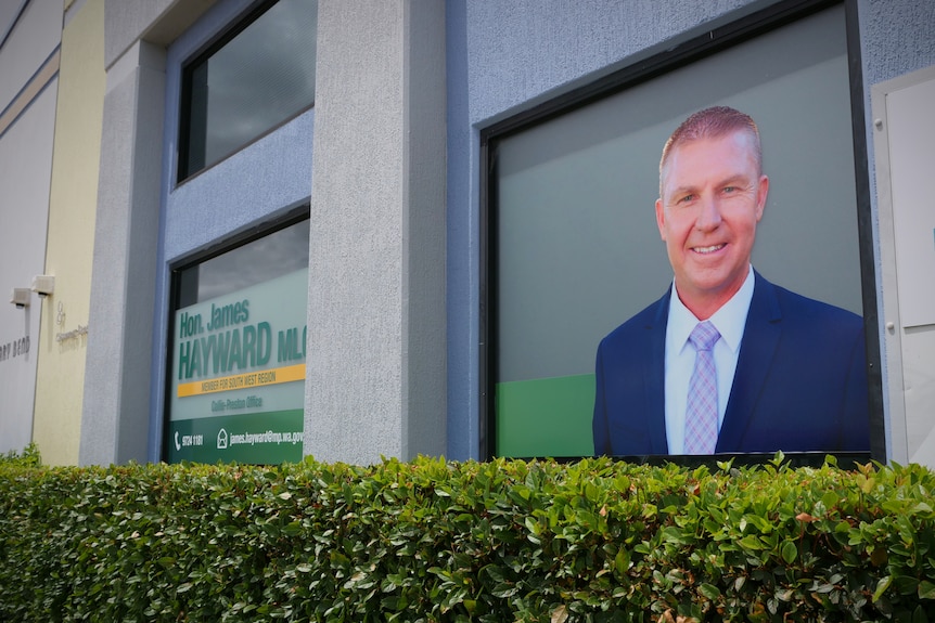 Branding material printed on the front of a window on a building