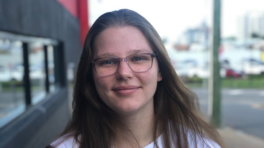 girl with long hair and glasses